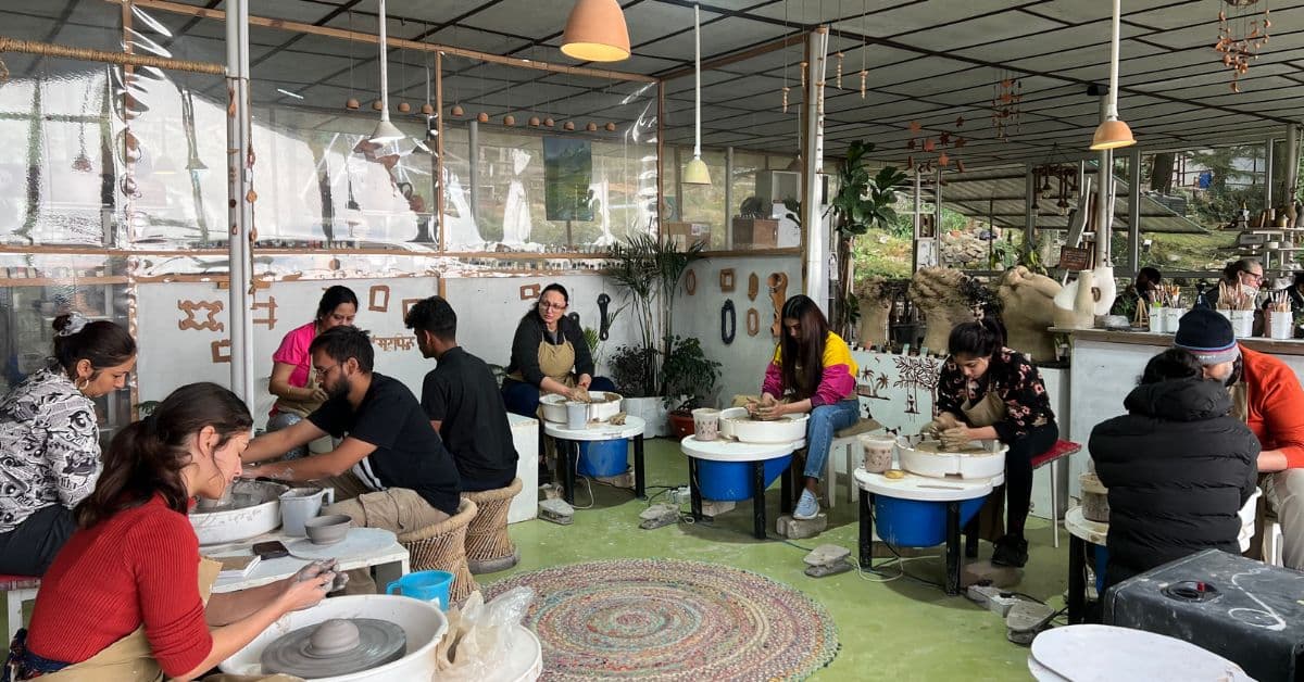 People practicing on pottery wheel in pottery retreat at Dharamkot Studio.