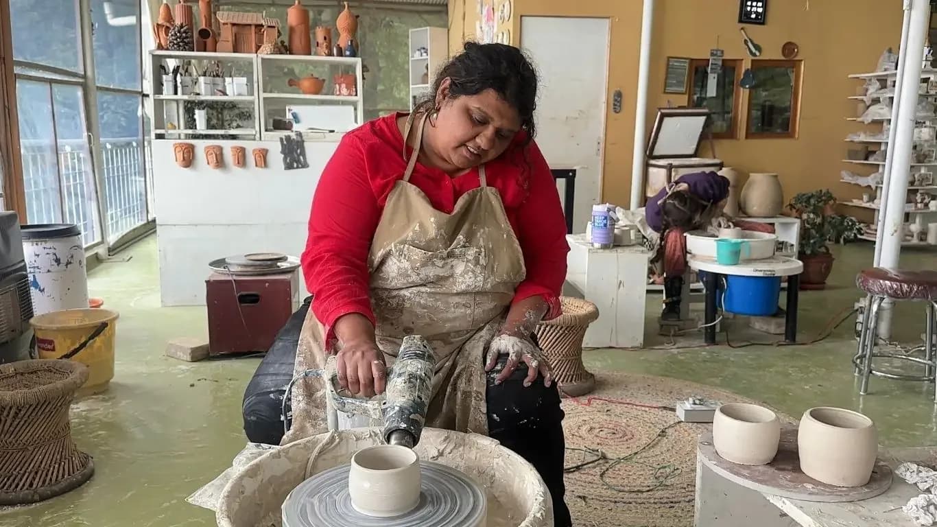 Critica from Chennai with functional pottery pieces during the beginners course.