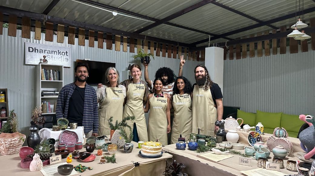 Beginner pottery students at Dharamkot Studio reflecting on their clay journey.