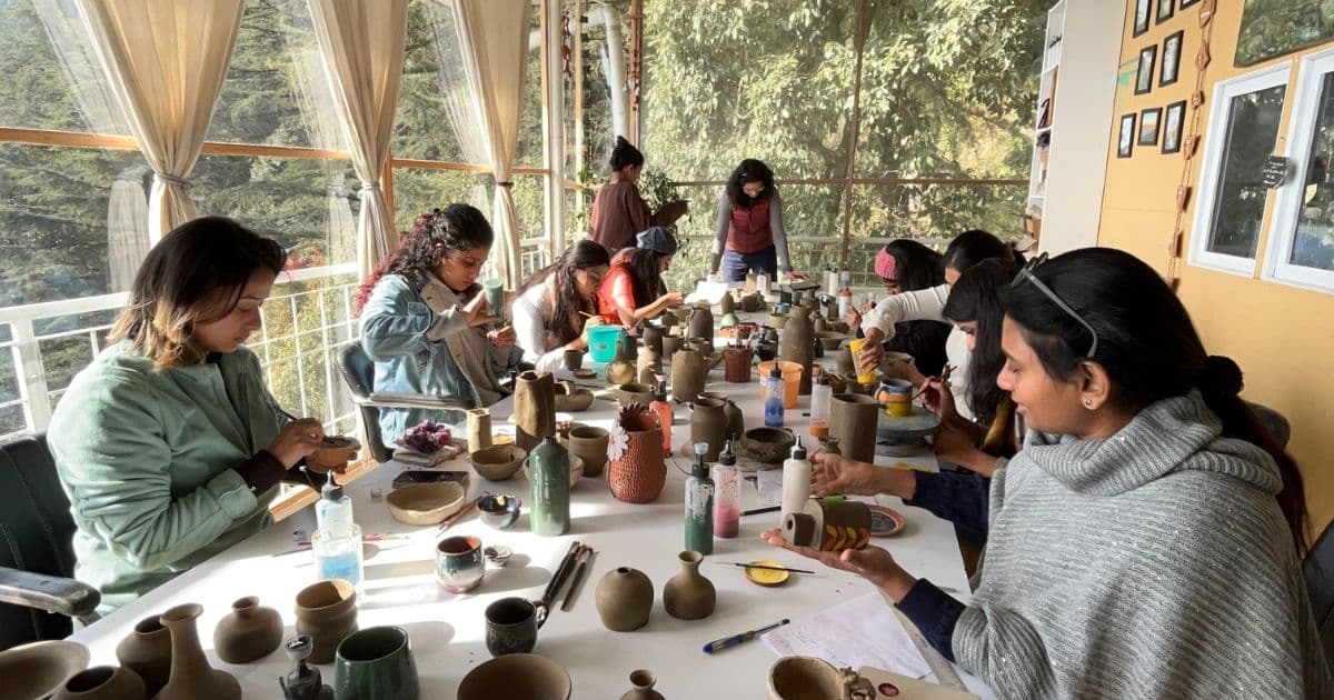 Pottery retreat participants learning ceramic art in Dharamkot, Himachal Pradesh.