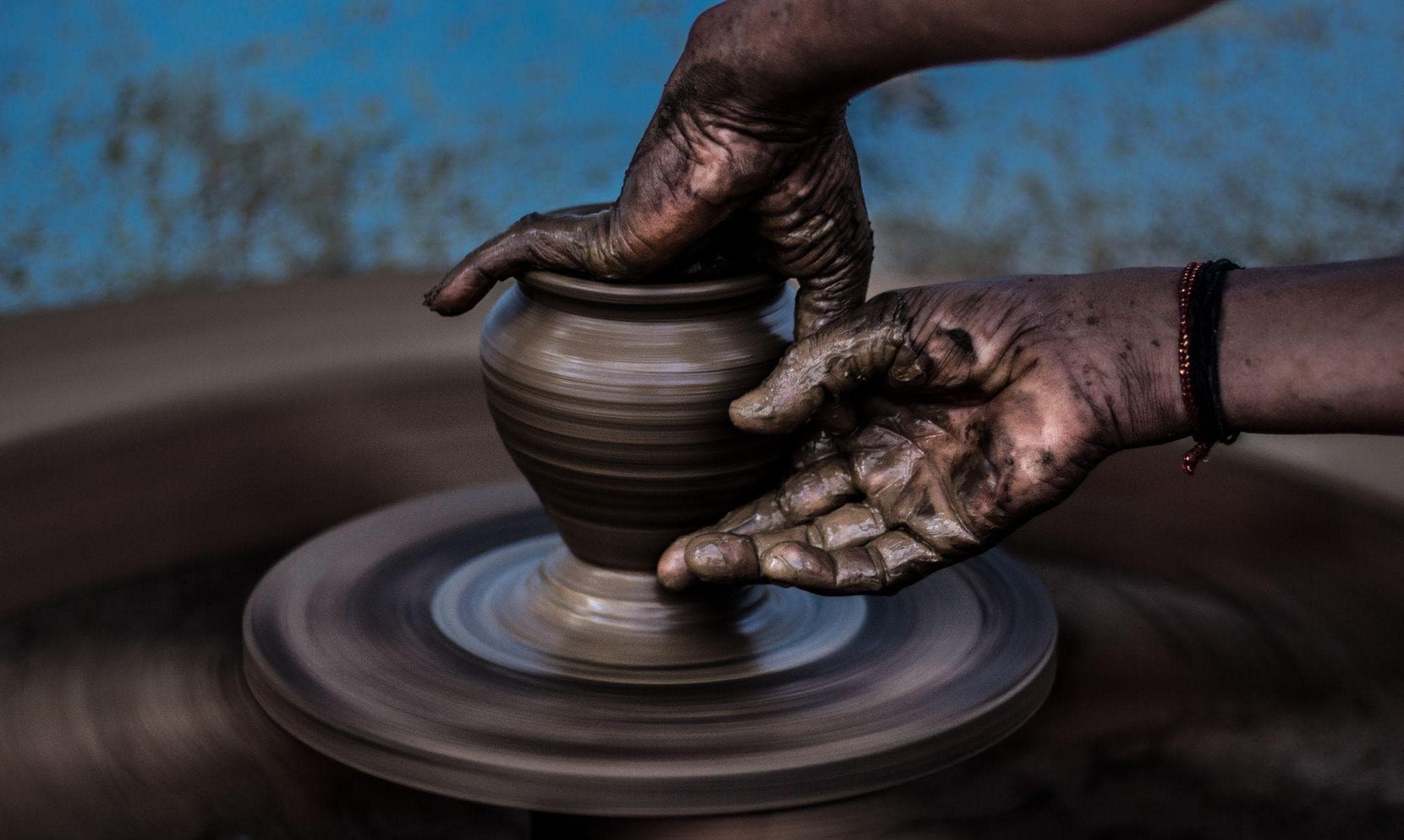 Children exploring clay in a pottery workshop in Dharamkot.