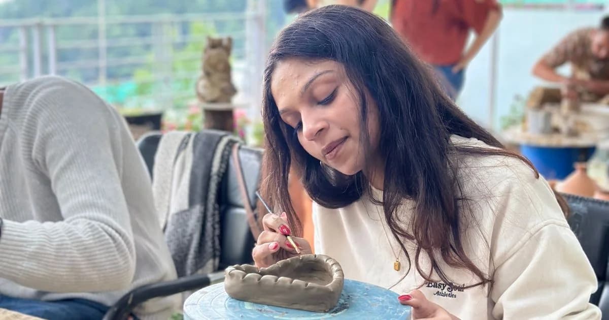 Pottery retreat studio scene showing clay connection and creative balance.
