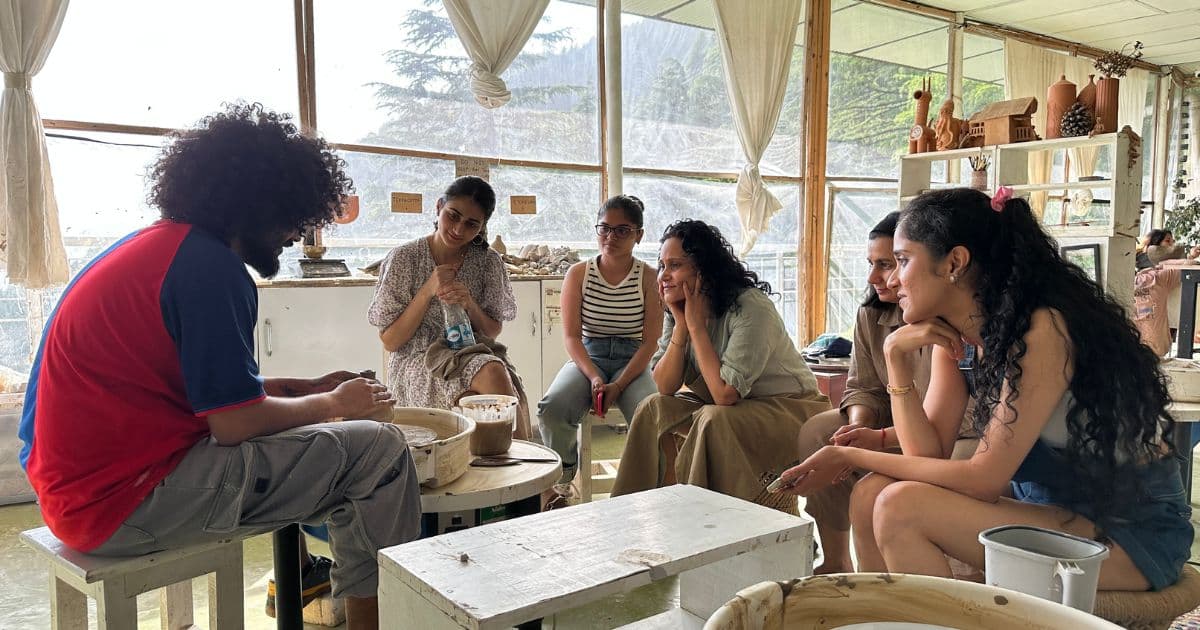 Pottery retreat participant rediscovering presence through focused clay practice.