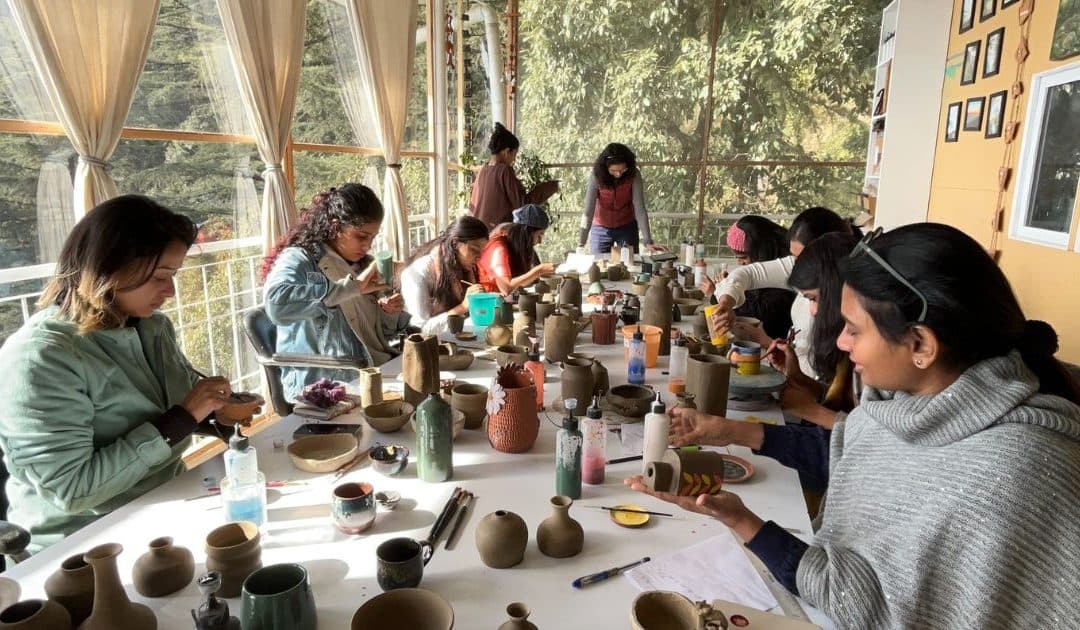 Pottery retreat participants learning ceramic art in Dharamkot.
