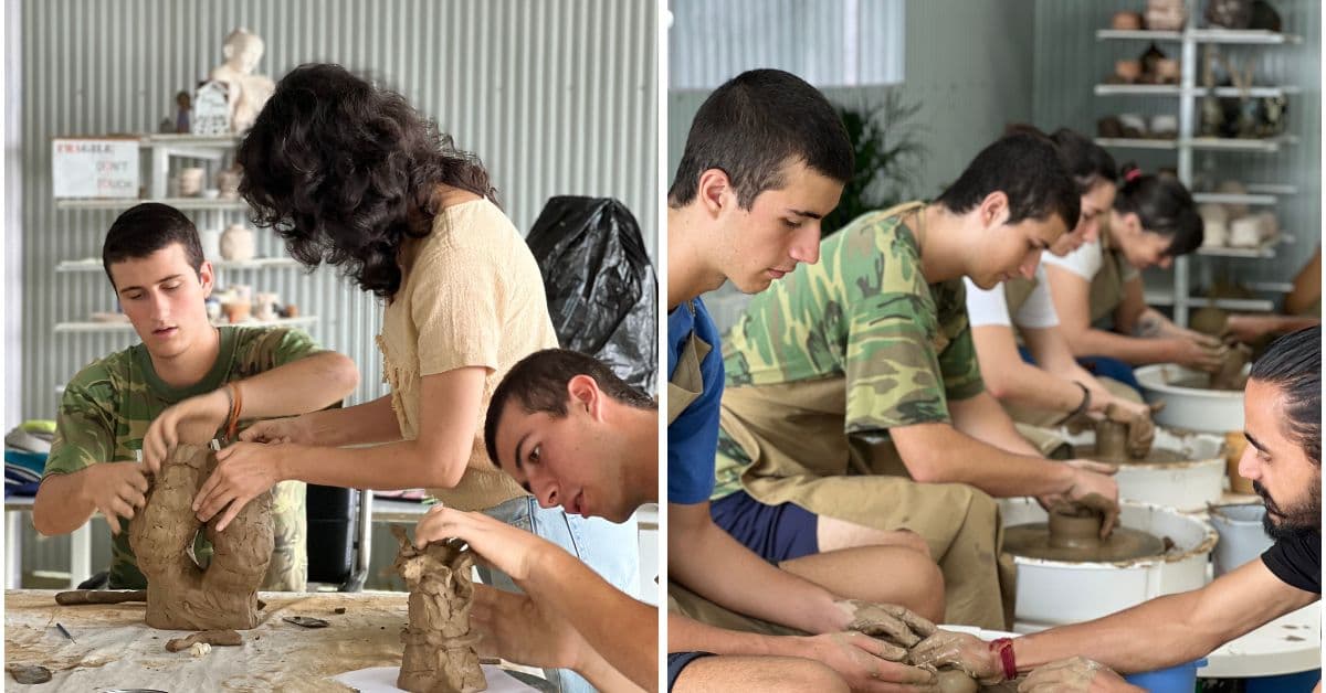 Instructor at Dharamkot Studio helping a student.
