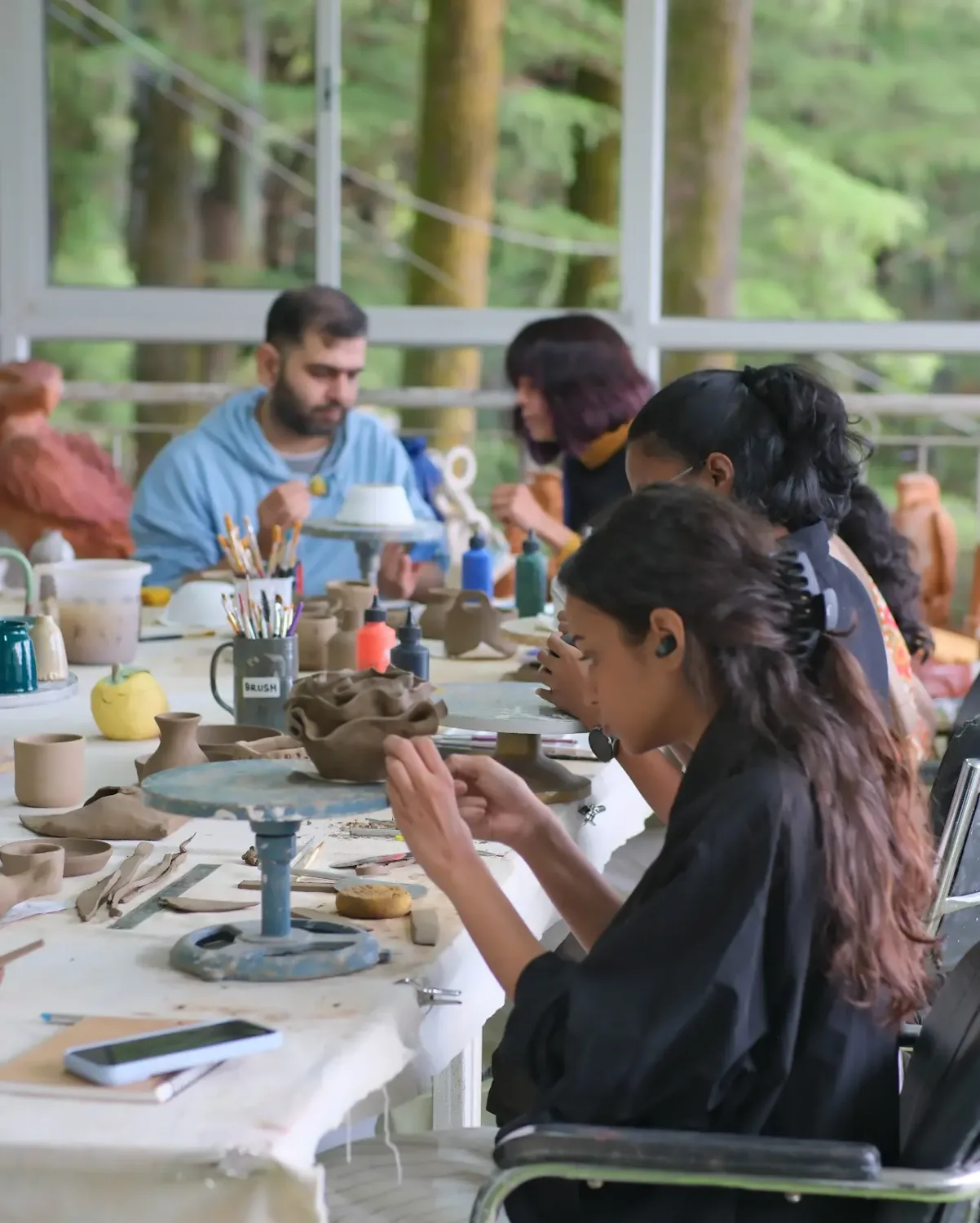 Dharamkot Studio retreat centre with pottery practice, forest views, and mountain studio life.
