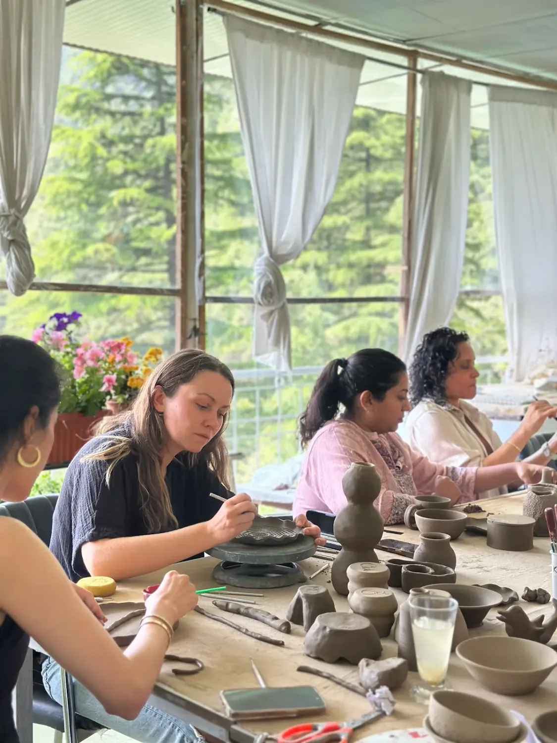 Dharamkot Studio retreat centre with pottery practice, forest views, and mountain studio life.
