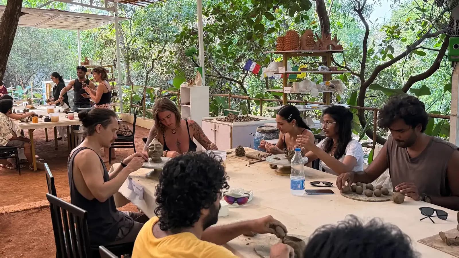 Dharamkot Studio Goa community art space and retreat sessions surrounded by greenery.