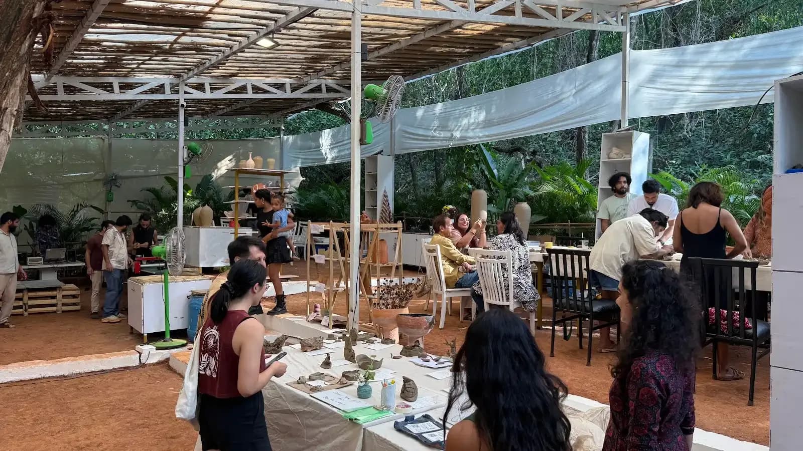 Dharamkot Studio Goa community art space and retreat sessions surrounded by greenery.