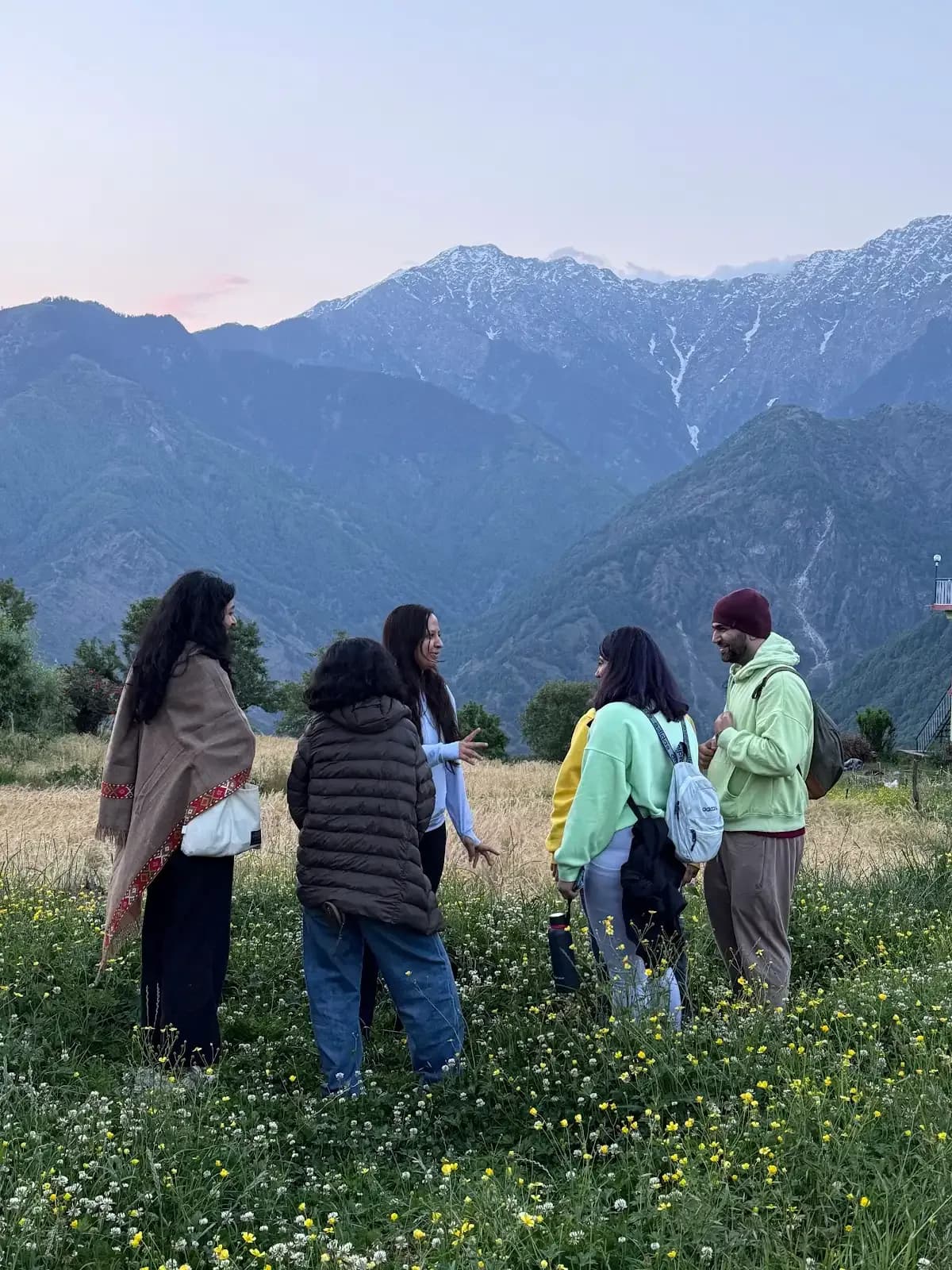 Participants walking through a Dharamkot forest path during the Himachal pottery retreat.
