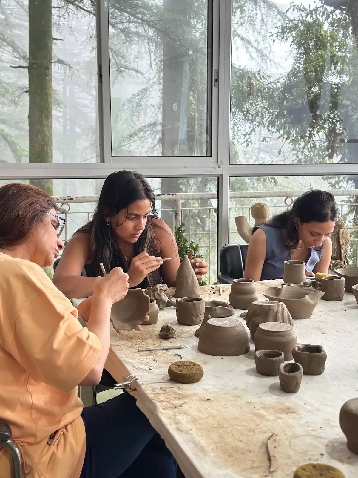 Handbuilding pottery session at the Himachal retreat studio.
