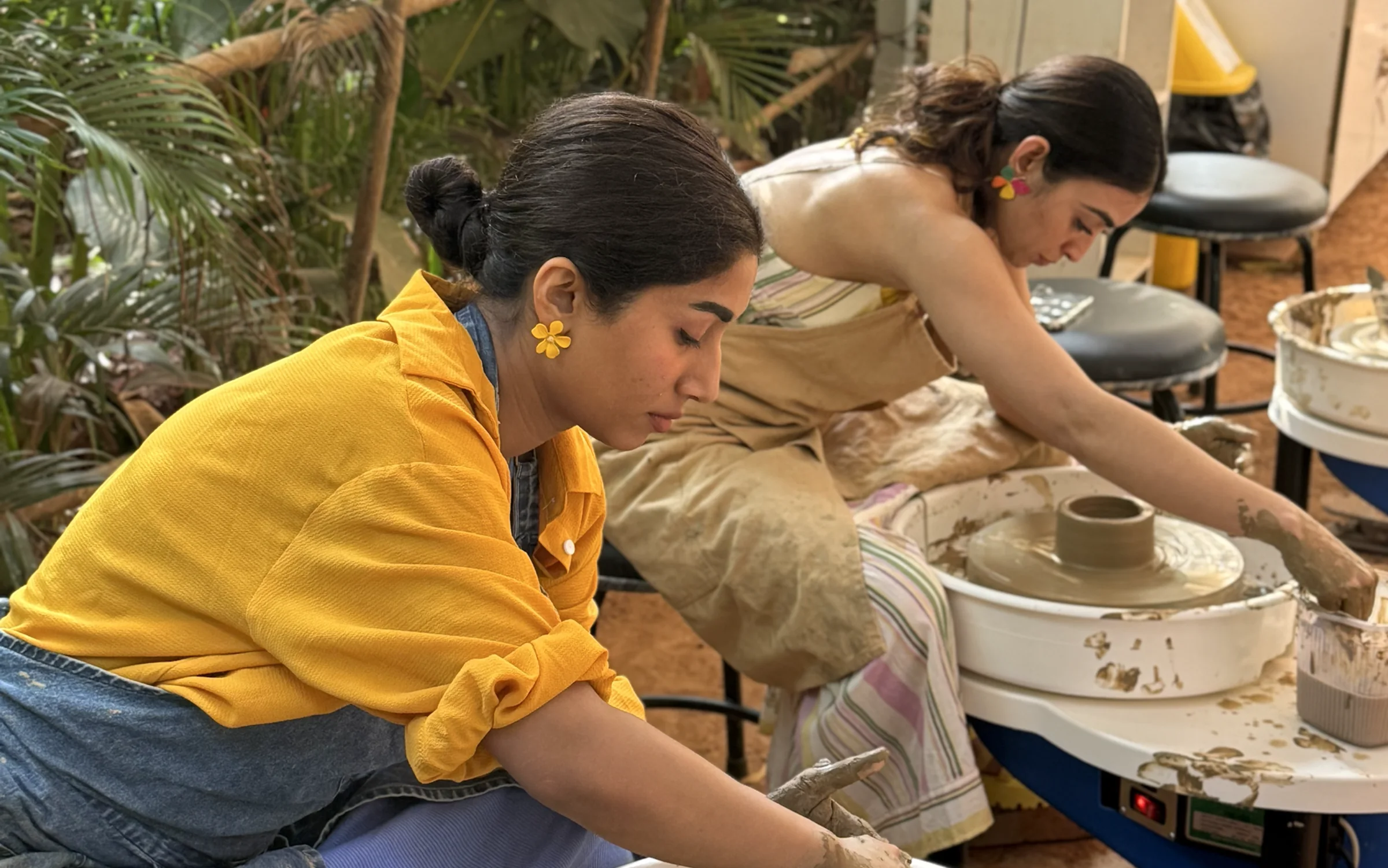 Participants practising wheel throwing during the Goa pottery retreat.