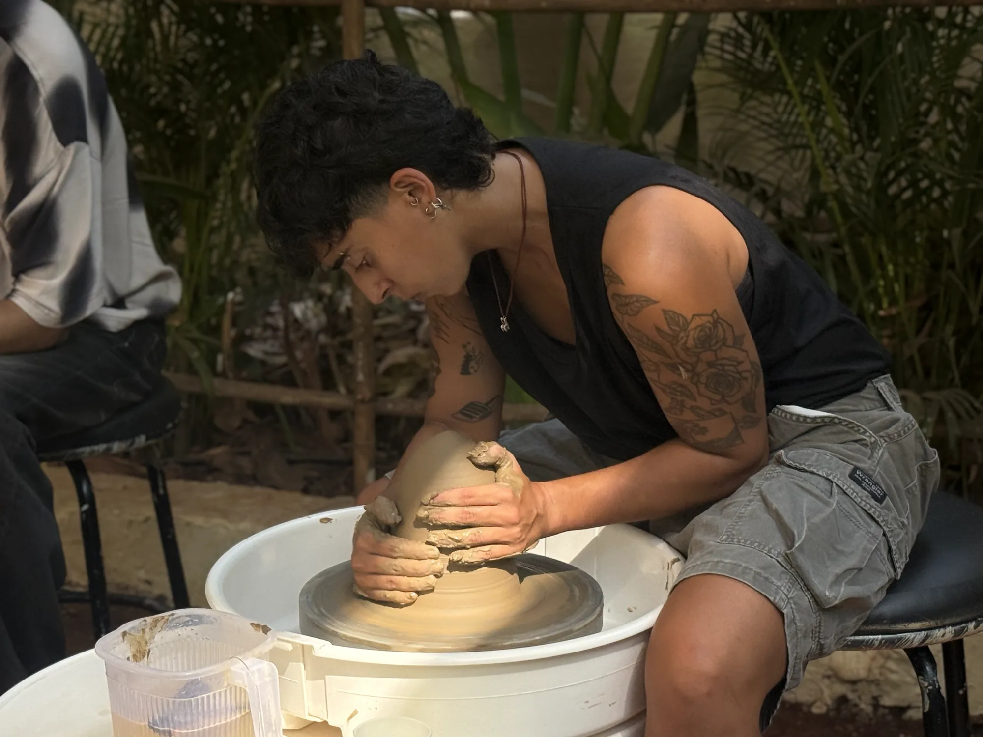 Potter concentrating on form and wheel control during the Goa Art of Wheel Throwing workshop.