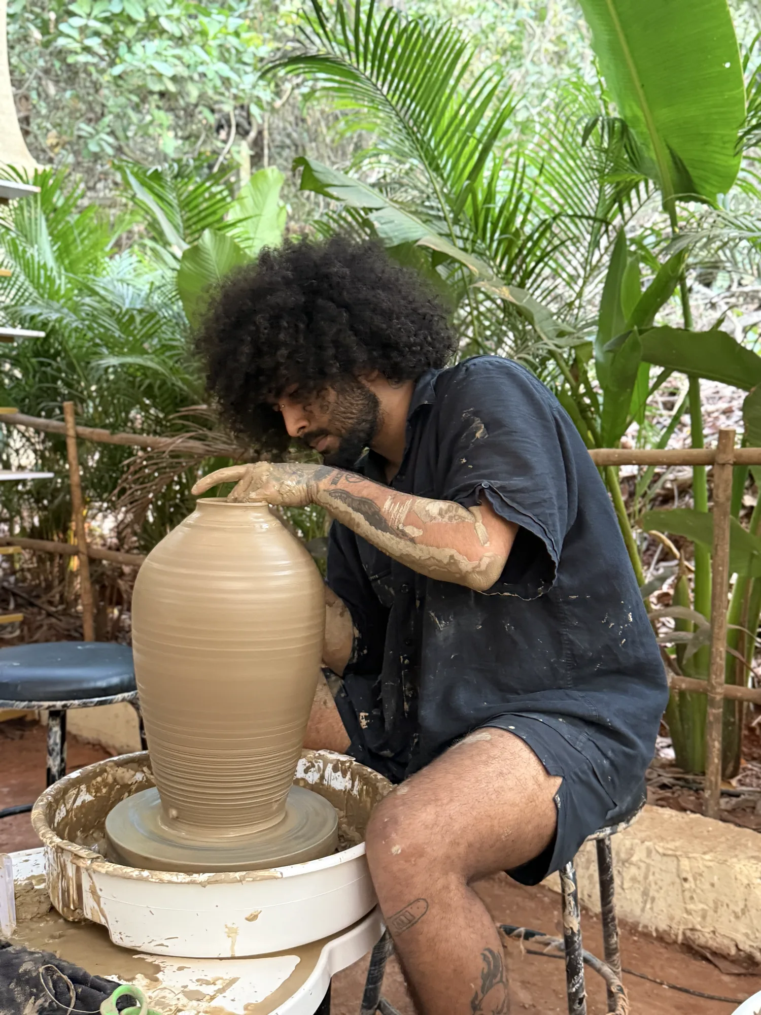 Large vase being thrown on the wheel during the Art of Wheel Throwing course at Dharamkot Studio Goa.