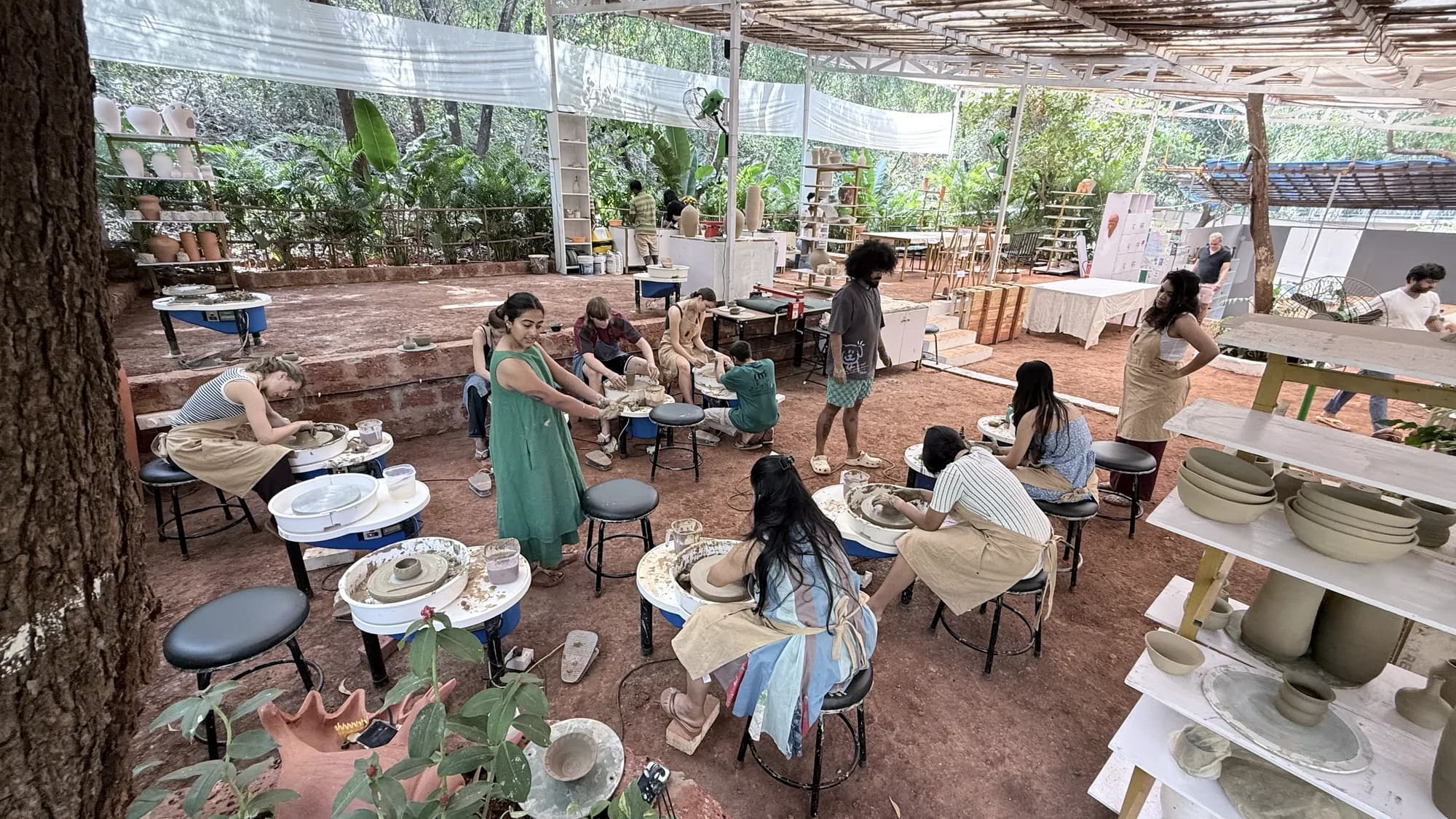The open Goa workshop space during a pottery wheel session at Dharamkot Studio.