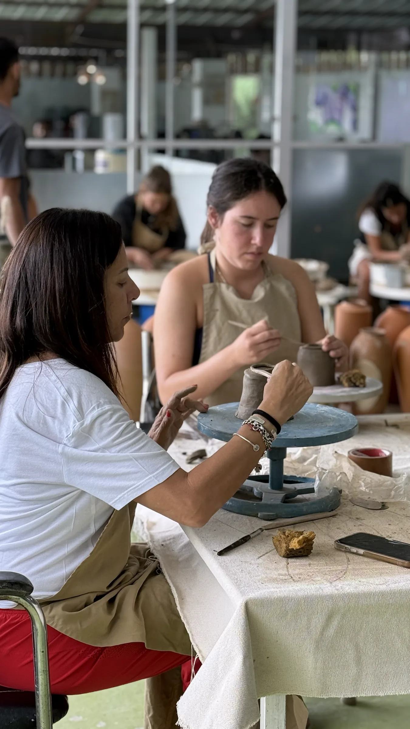 A young participant shaping clay during the Open Clay Session at Dharamkot Studio in Himachal Pradesh.