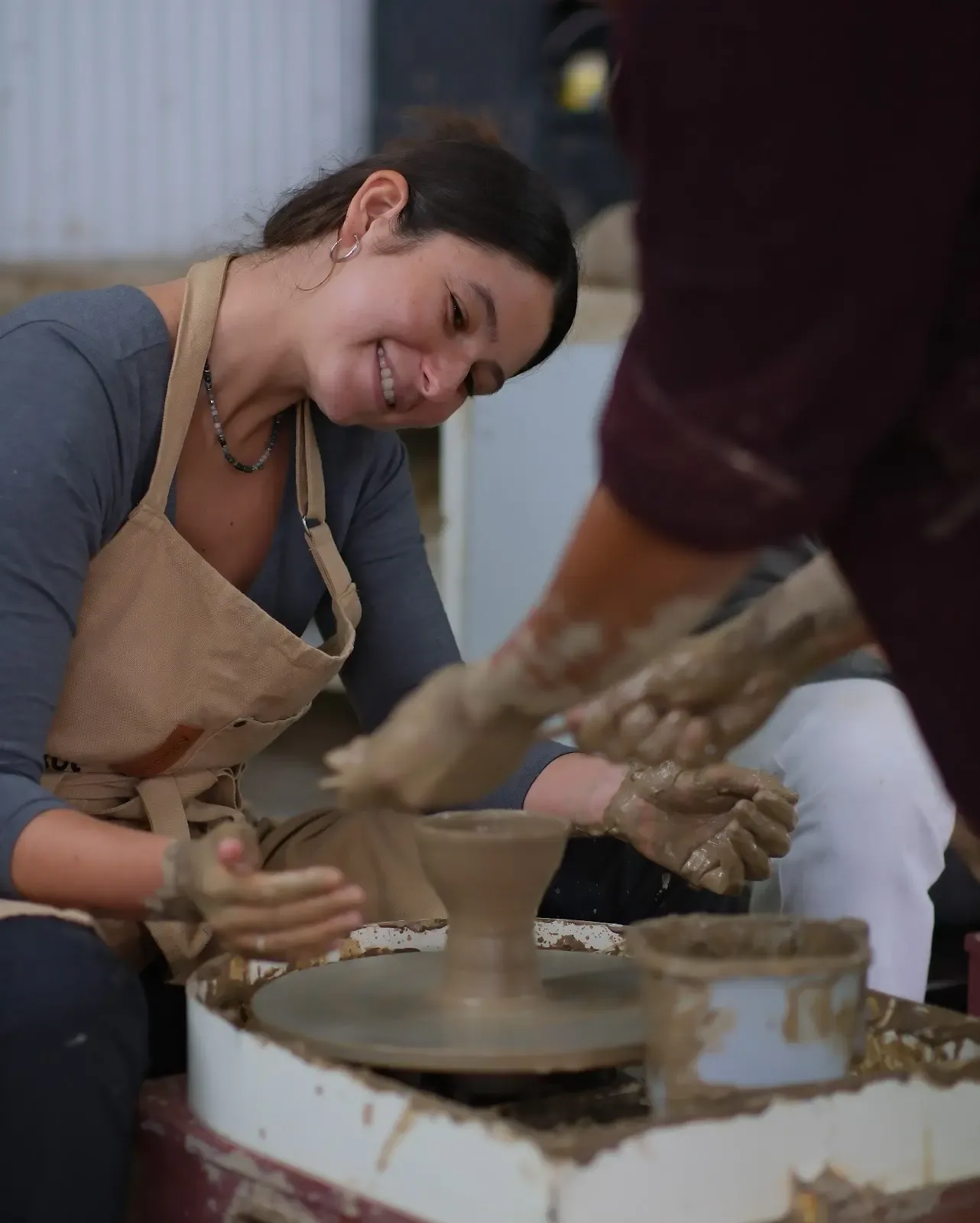 Guided pottery wheel experience for beginners at Dharamkot Studio in Himachal Pradesh.