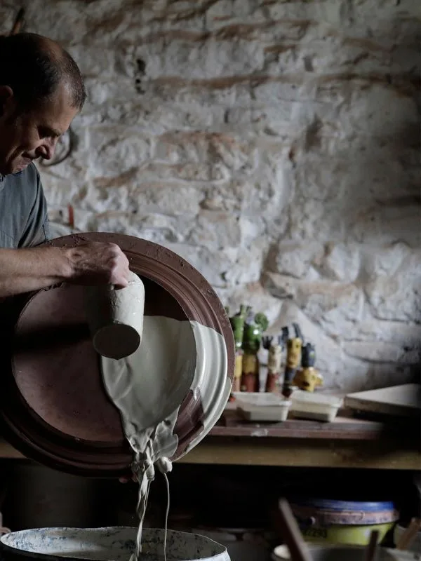 Advanced ceramic workshop practice with expressive slipware surfaces in Dharamkot.