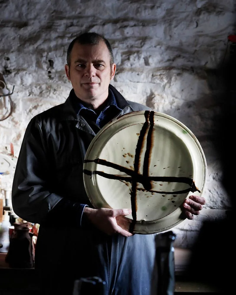 British slipware ceramic artist Dylan Bowen leading the Dharamkot Studio workshop.
